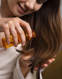 side-view-woman-hair-slugging-night-routine-min